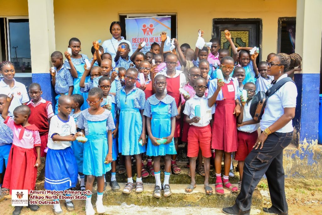 Our team in group pictures with some of the beneficiaries of the free eyeglasses.