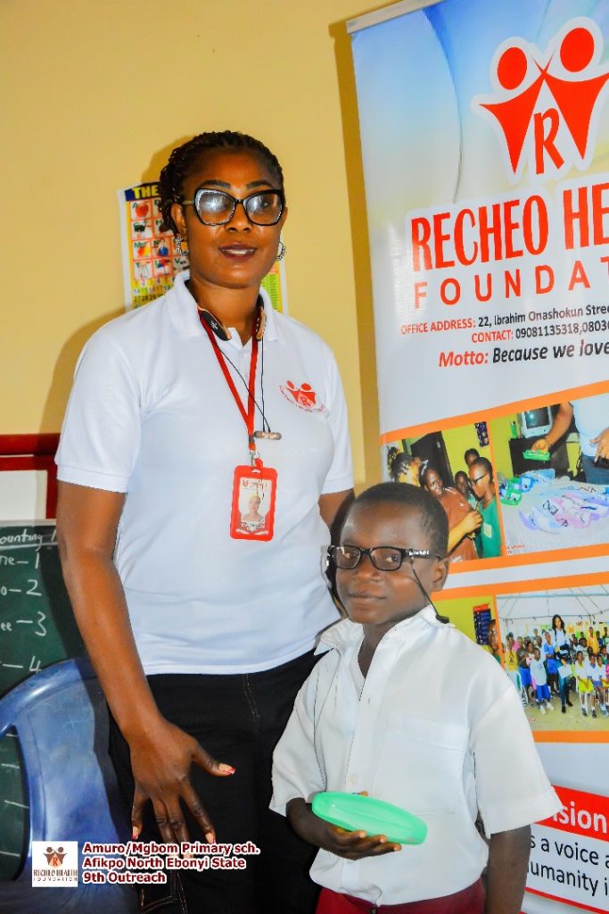 Our Chairperson in poses with one of the pupils.
