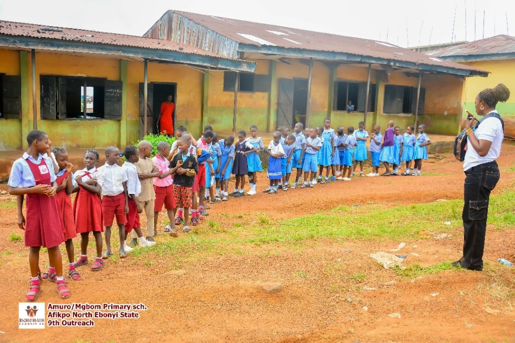 The pupils in a single file waiting patiently for their respective turn.